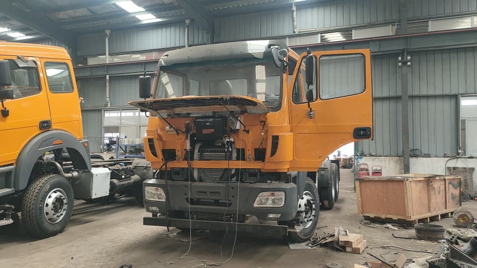 Orange truck cab on the production floor